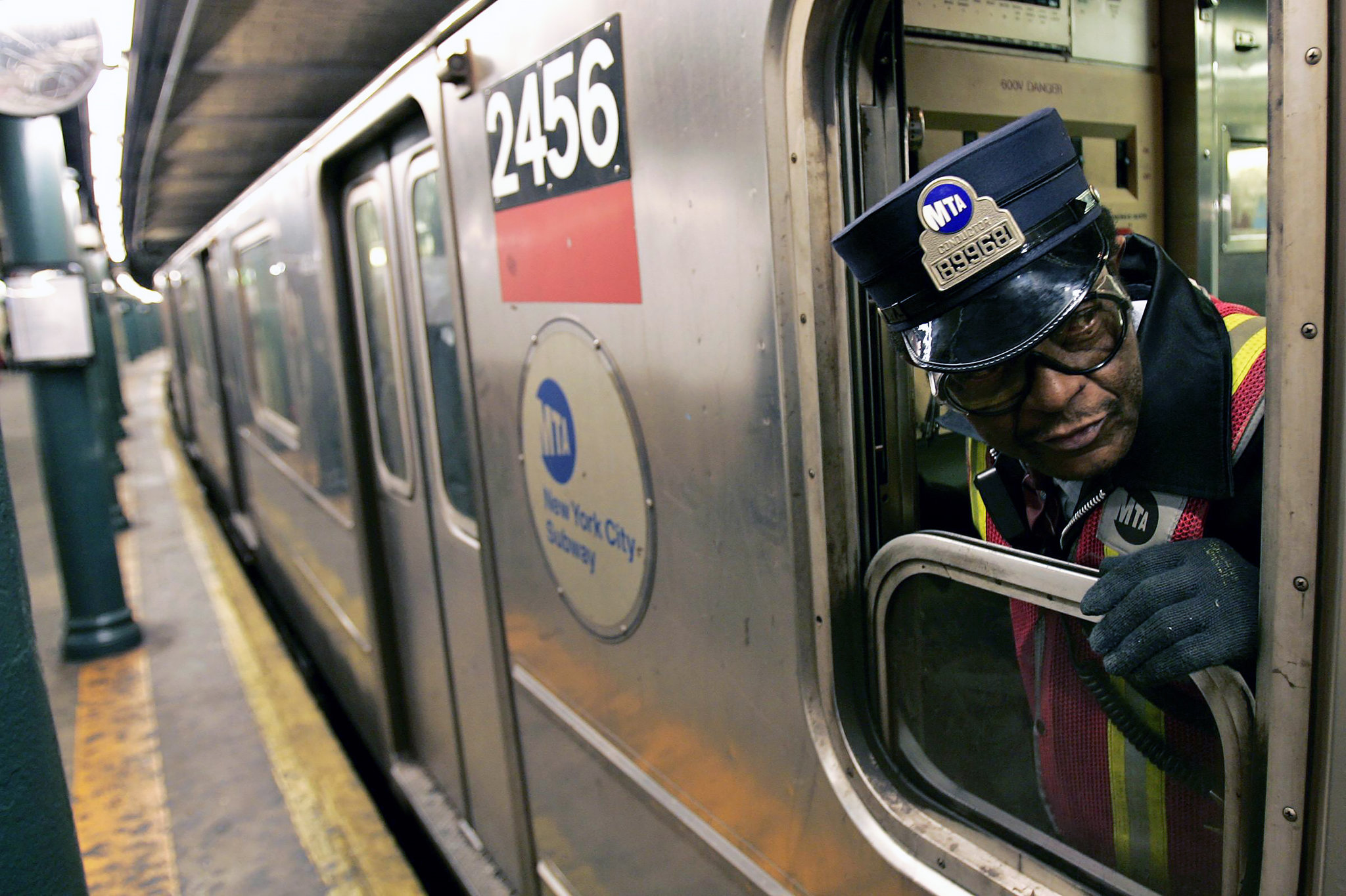 New Afrikan MTA Conductor at work in a subway train.